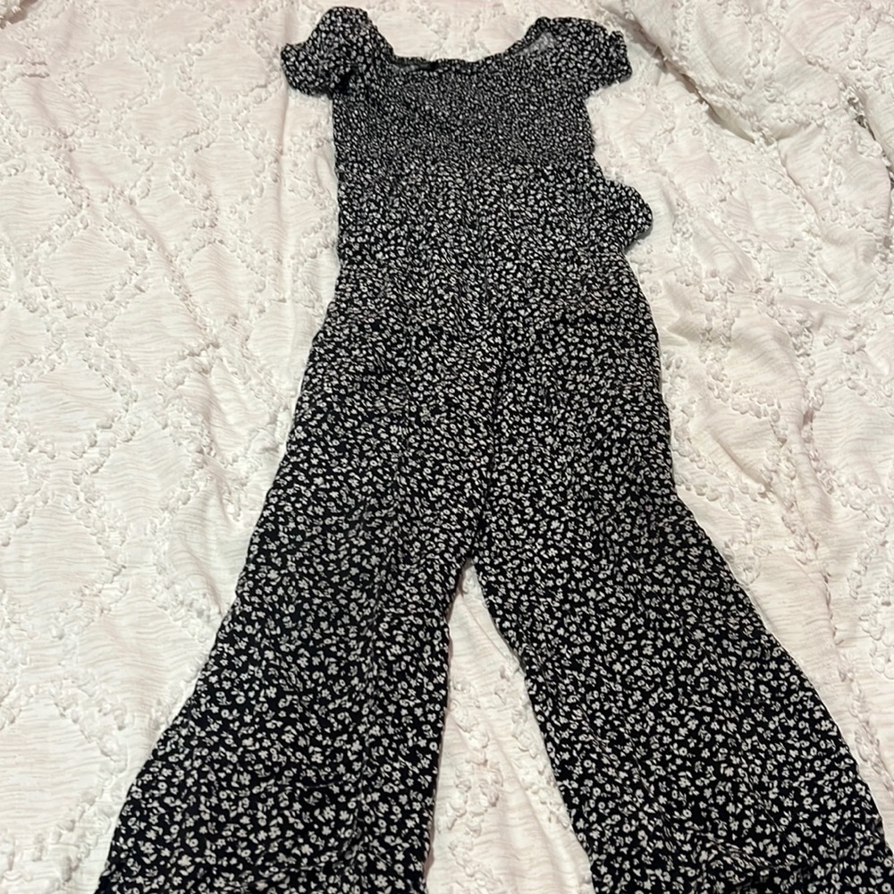 It’s a black and white flower shirt from the brand art class